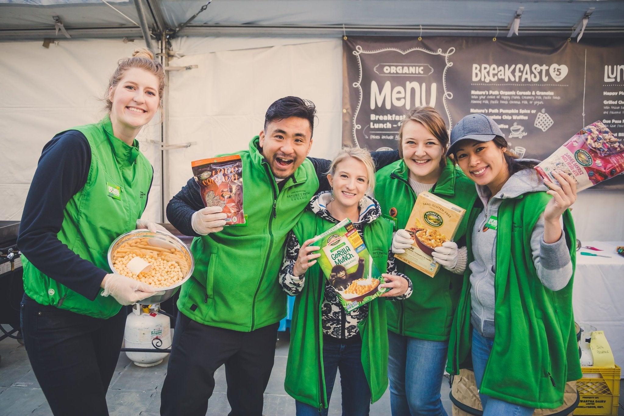 Nature's Path team members holding cereal boxes